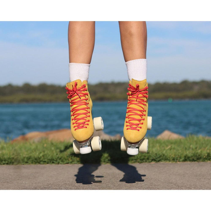 Chuffed Skates yellow roller skates jumping