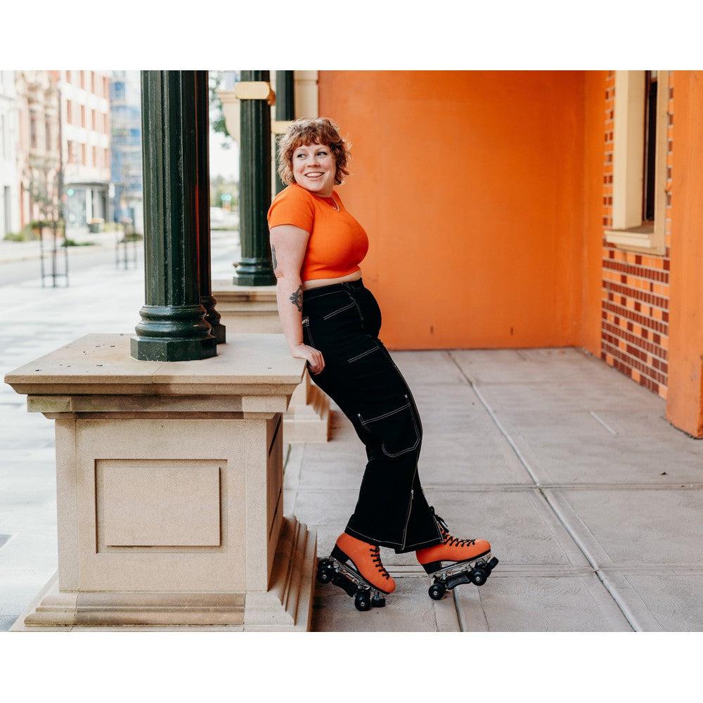 Orange Pro Boot rollerskate, Sophie with orange background